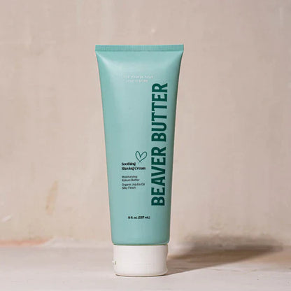 A blue tube of Beaver Butter soothing shaving cream on a white background.