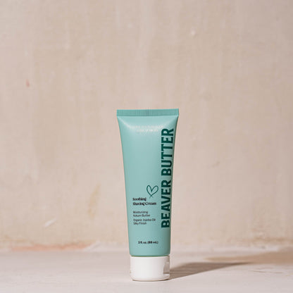 A blue tube of Beaver Butter soothing shaving cream on a white background.